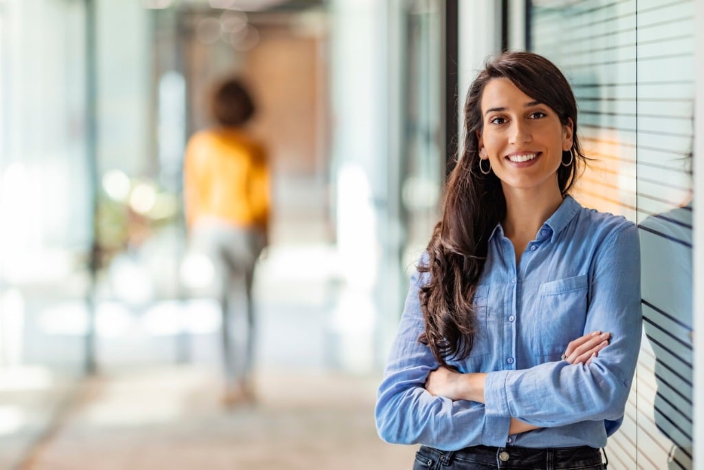 Oil and Gas Accounting Job Security: How to Survive and Thrive During Tough Times - 1 - Council of Petroleum Accountants Societies smiling-accountant